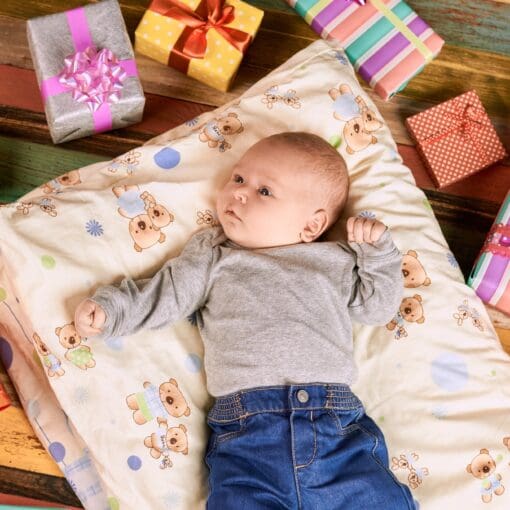 Baby Lying Near Presents