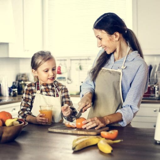 Daughter Helping Mom In Preparing Food