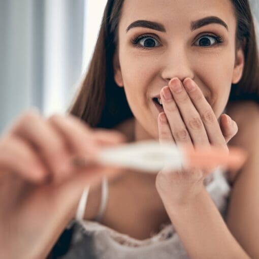 Happy Young Lady Is Showing Pregnancy Test