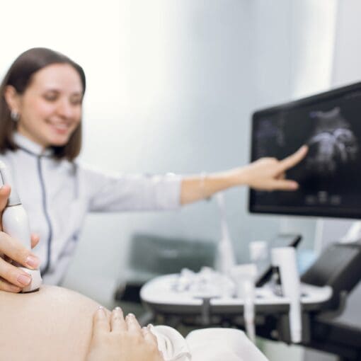 Cropped Shot Of A Pregnant Woman During Ultrasound Scanning At The Fertility Clinic.