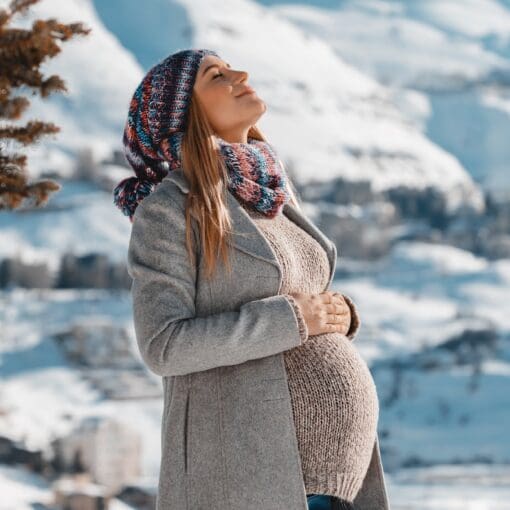 Happy Pregnant Woman Enjoying Winter
