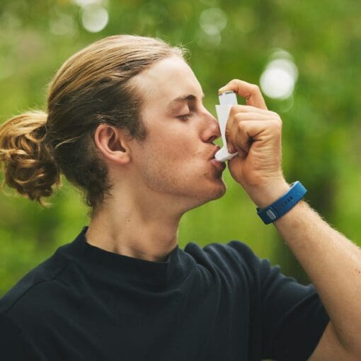 Man Breathe Asthma Pump Outdoor In Garden, Park And Help With Health Risk, Cough Treatment And Stre