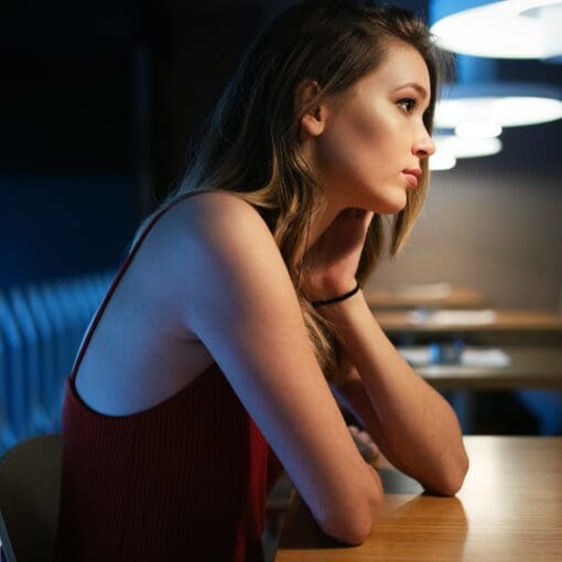 Portrait Of Clever Young Woman Thinking Alone